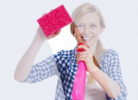 Vacuuming a rug to remove dust and debris