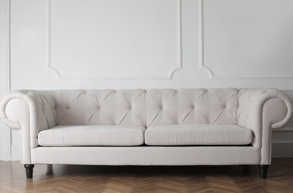 A close-up view of a long, modern seating bench upholstered in bright blue material, arranged along a plain white wall inside a commercial space near The Glades Bromley shopping centre. The benches ar